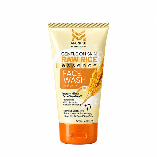 A squeeze tube of Mark 30 Professionals Raw Rice Essence Face Wash on a solid white background. The packaging features a cream-colored upper section with gold and black text, an orange label, and a bright orange cap, decorated with illustrations of raw rice grains.